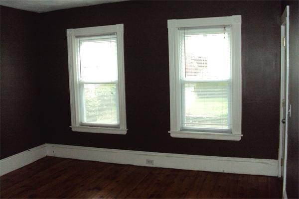 6 Beckman Street Worcester, MA 01607 - Photo 5 of 18 a view of an empty room with wooden floor and a window