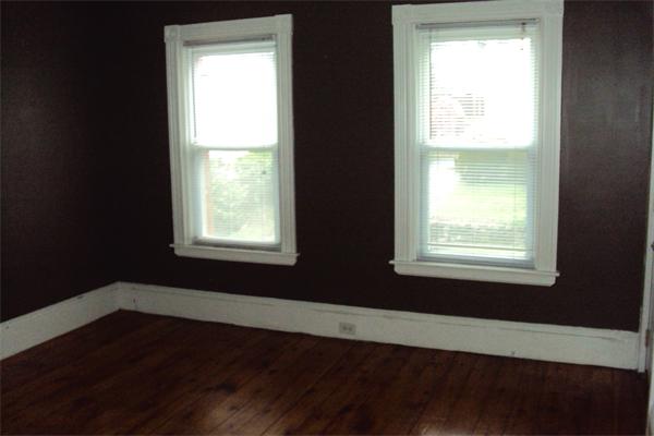 6 Beckman Street Worcester, MA 01607 - Photo 6 of 18 a view of an empty room with wooden floor and a window