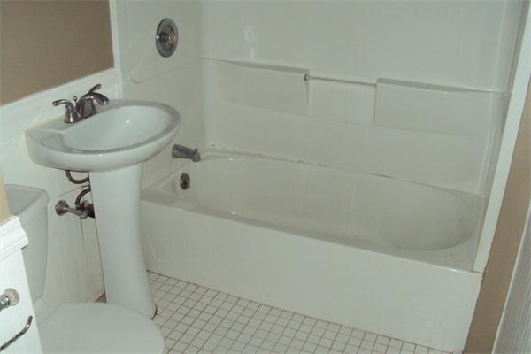 6 Beckman Street Worcester, MA 01607 - Photo 8 of 18 a bathroom with a sink a toilet and shower