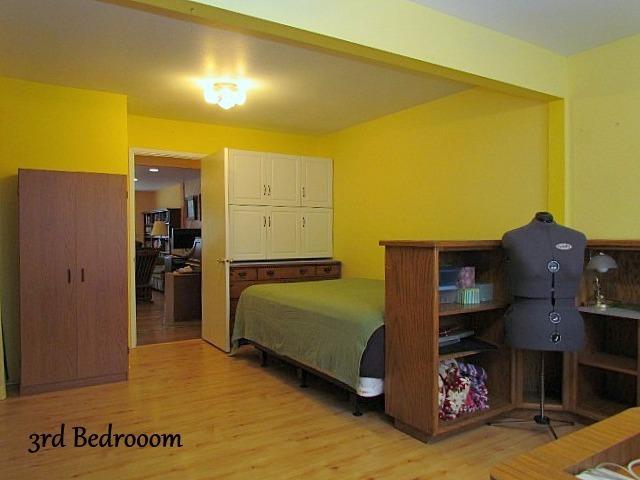 6710 North Applegate Road Grants Pass, OR 97527 - Photo 20 of 33 a bedroom with a bed and cabinets