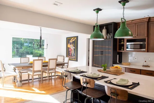 a kitchen with a table and chairs in it