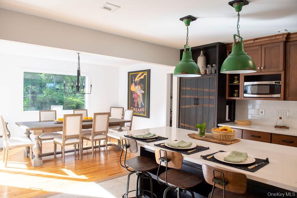 1045 Wagon Wheel Lane Cutchogue, NY 11935 - Photo 14 of 31 a living room with furniture kitchen view and a large window