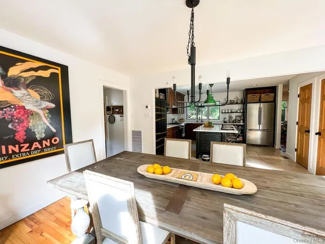 a bedroom with a bed window and a mirror