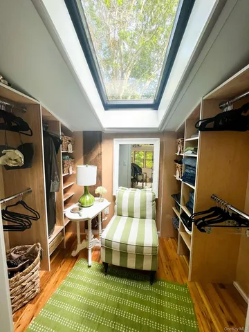 a bathroom with a granite countertop sink a mirror and shower