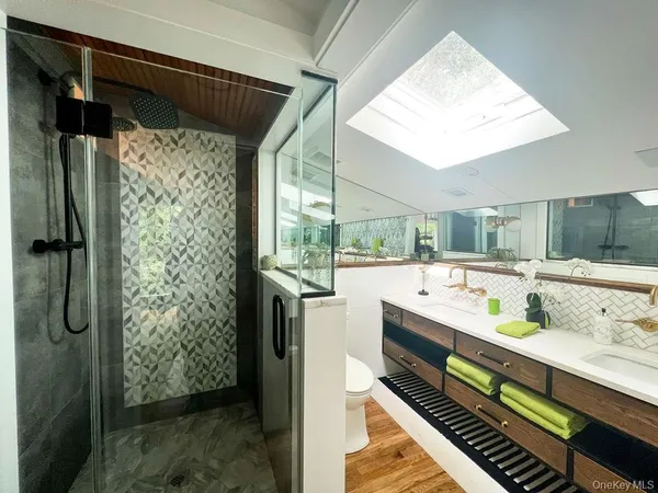 a large white kitchen with a large window