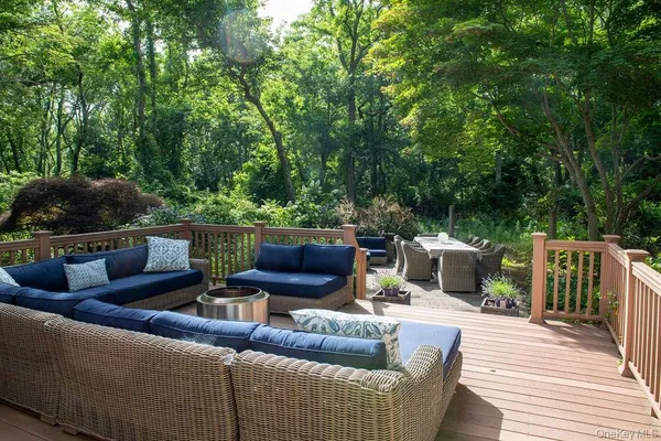 a view of an outdoor sitting area with brick walls