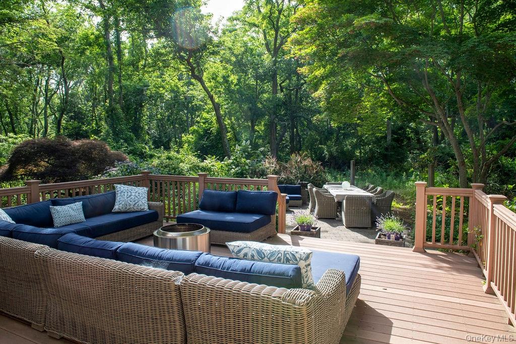1045 Wagon Wheel Lane Cutchogue, NY 11935 - Photo 27 of 31 a outdoor living space with furniture and garden view