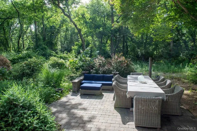 a view of roof deck with patio