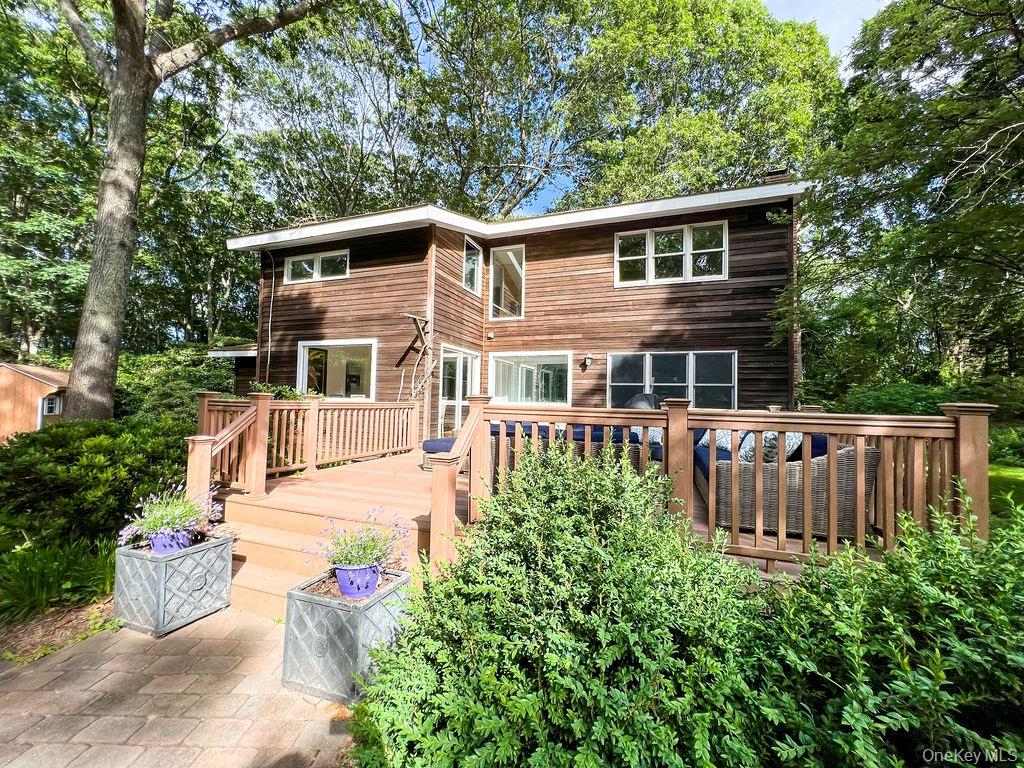1045 Wagon Wheel Lane Cutchogue, NY 11935 - Photo 3 of 31 a view of a house with wooden floor and a yard