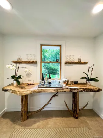 a living room with furniture fireplace and flat screen tv