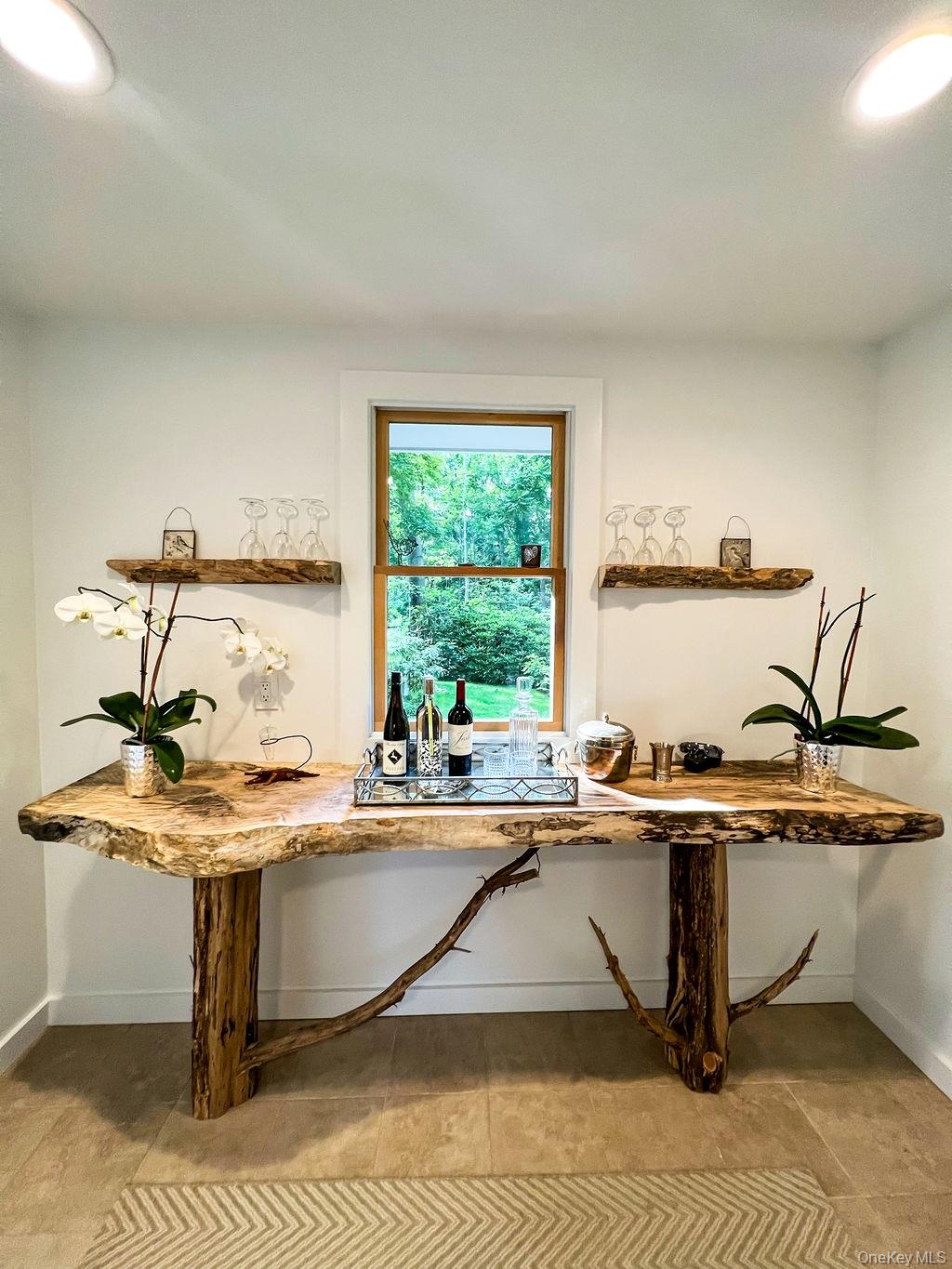 1045 Wagon Wheel Lane Cutchogue, NY 11935 - Photo 5 of 31 a room with table chairs and window