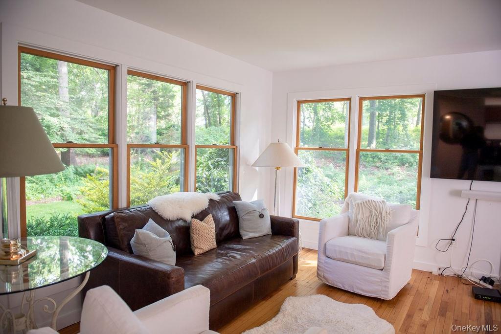 1045 Wagon Wheel Lane Cutchogue, NY 11935 - Photo 9 of 31 a living room with furniture and a large window