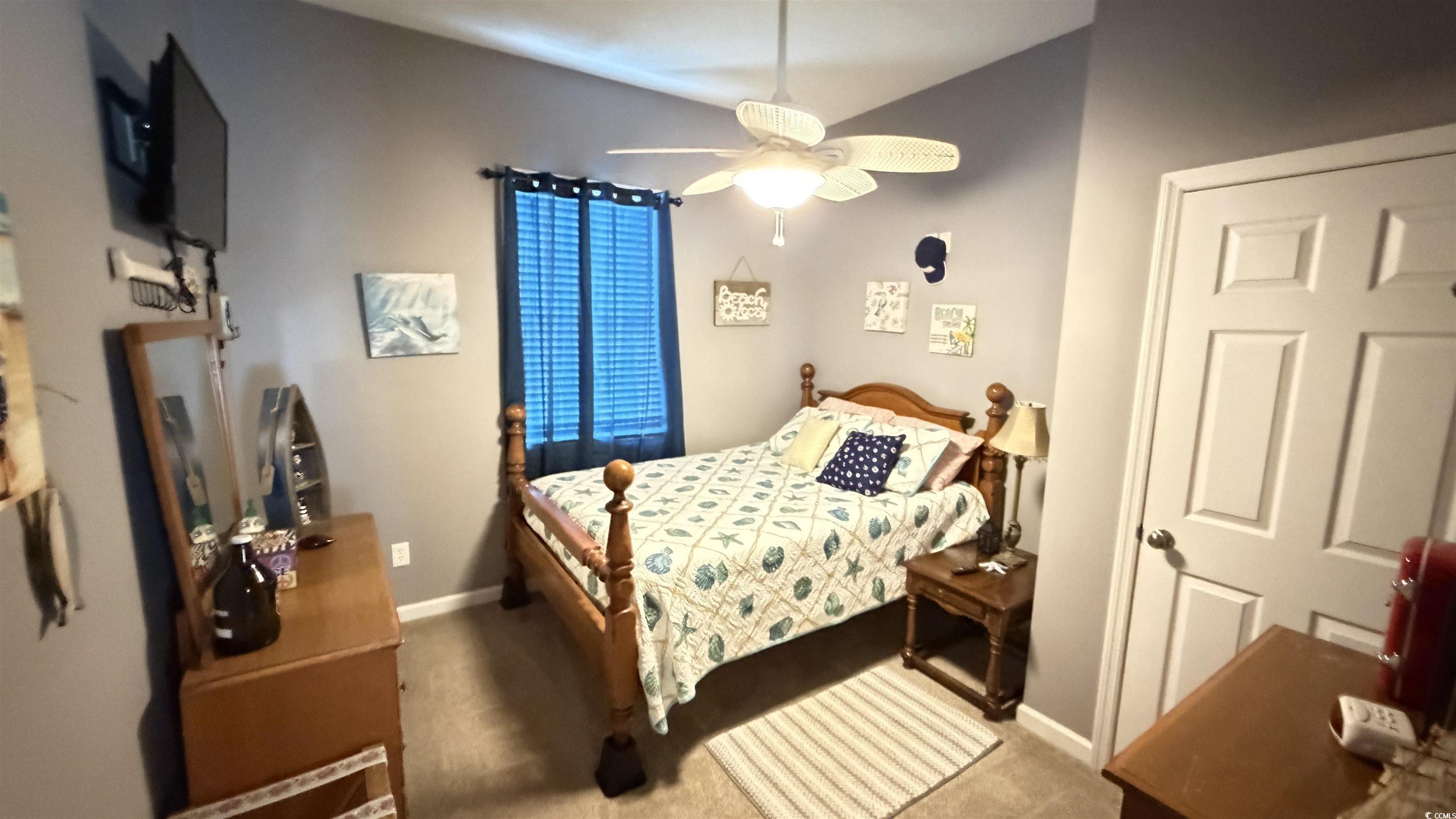 1517 Pisces Lane Myrtle Beach, SC 29575 - Photo 16 of 30 Carpeted bedroom with ceiling fan and baseboards