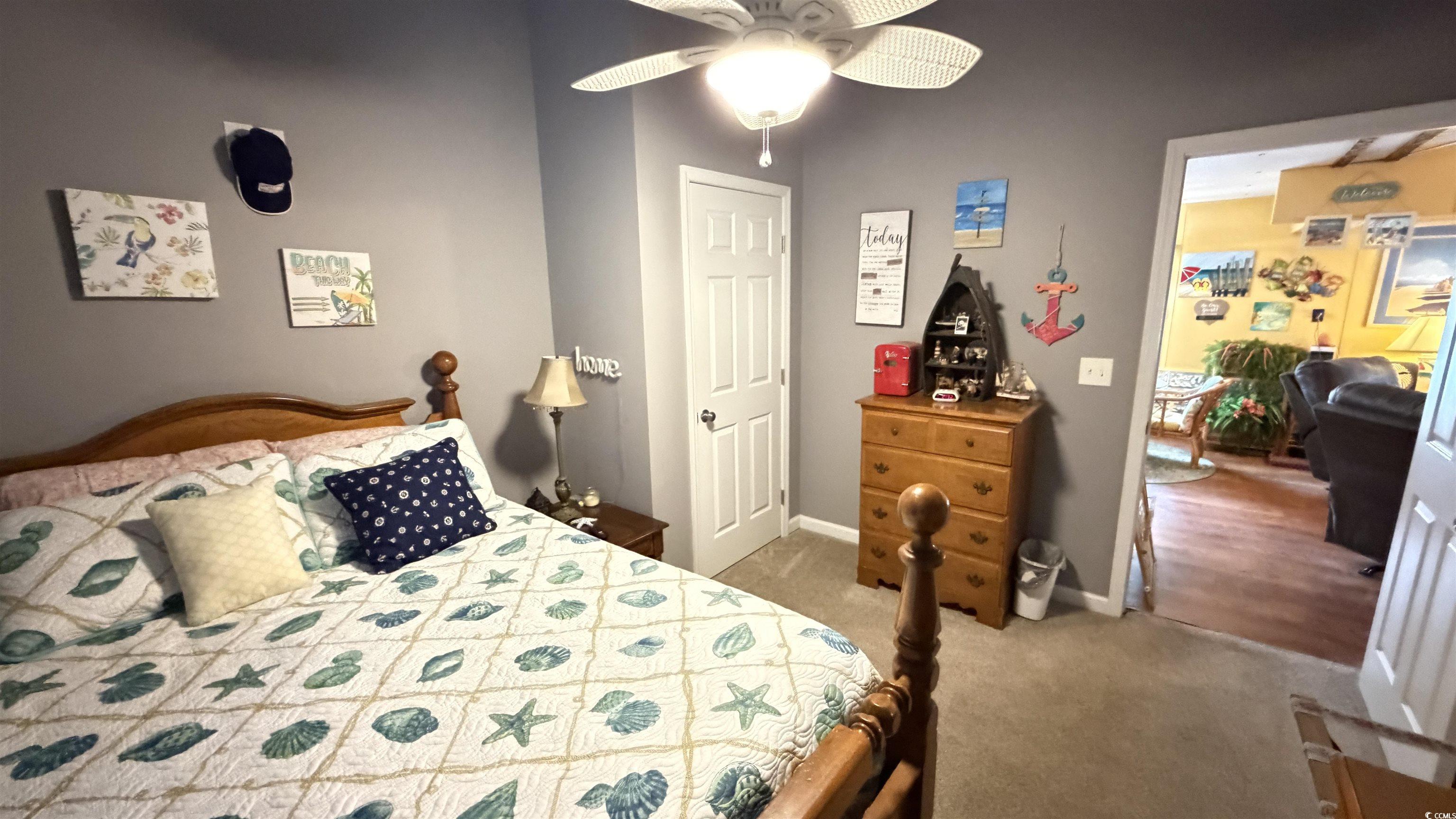 1517 Pisces Lane Myrtle Beach, SC 29575 - Photo 17 of 30 Bedroom featuring light carpet and a ceiling fan