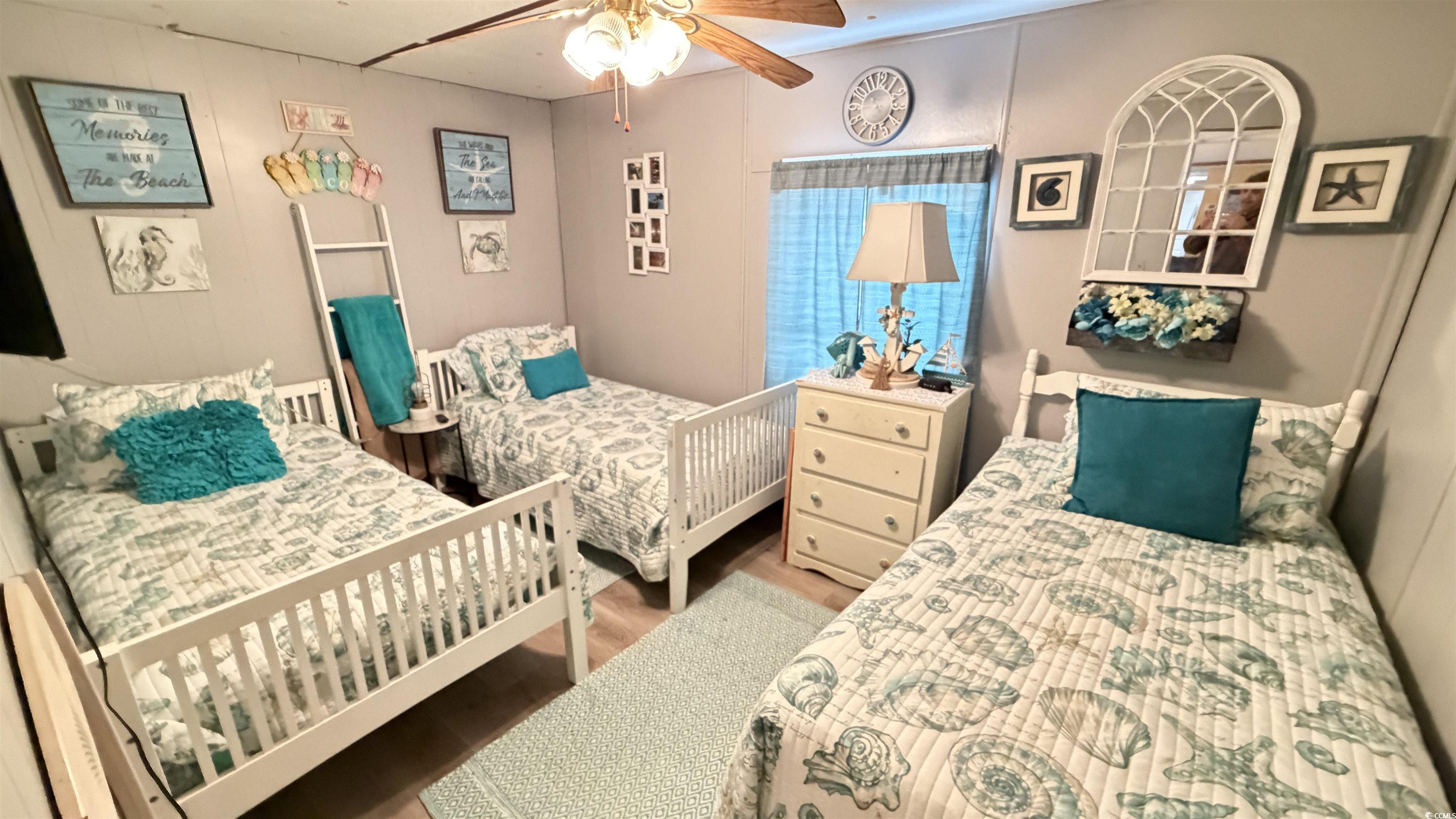 1517 Pisces Lane Myrtle Beach, SC 29575 - Photo 18 of 30 Bedroom with wood finished floors and ceiling fan