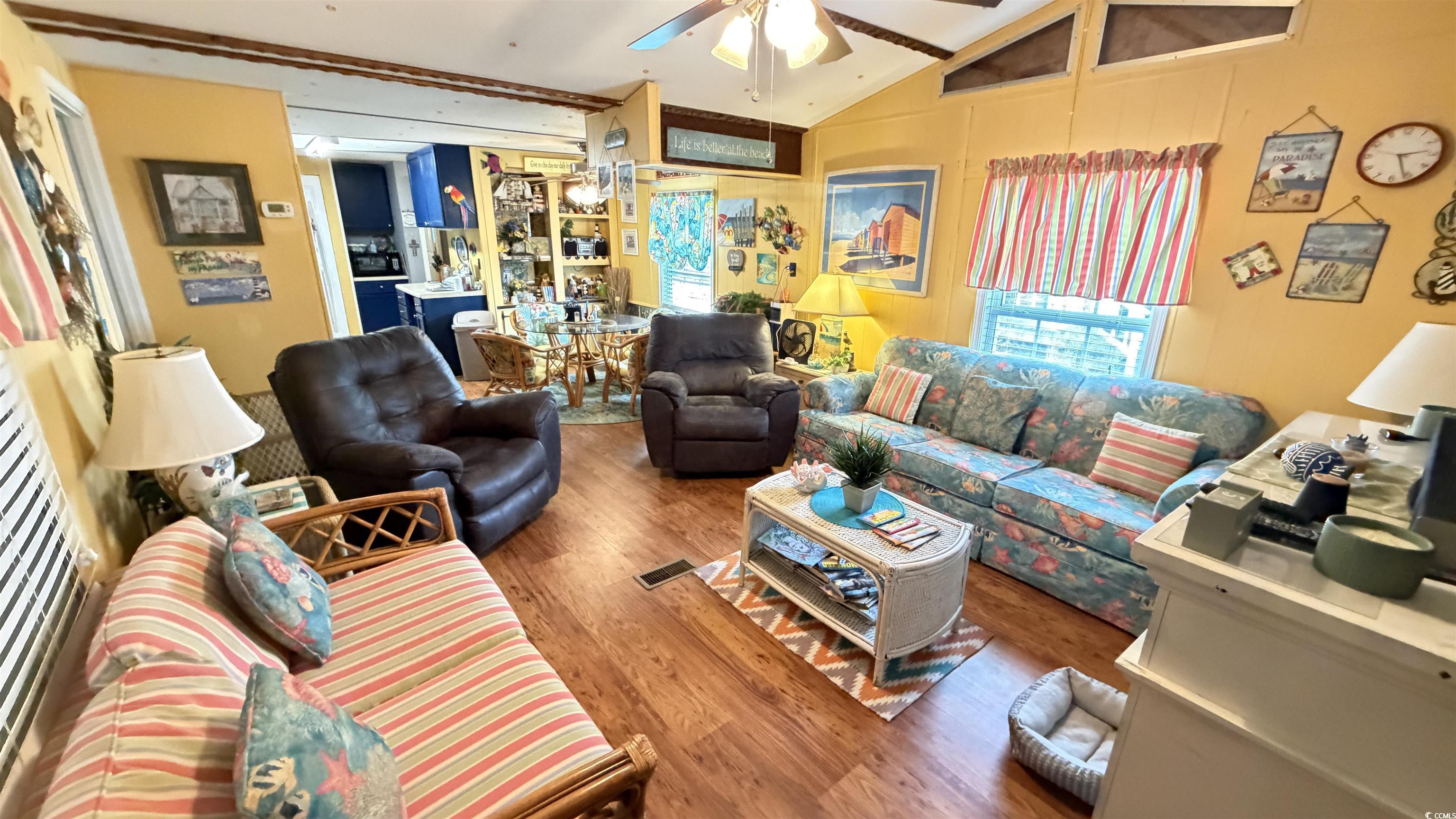 1517 Pisces Lane Myrtle Beach, SC 29575 - Photo 2 of 30 Living room featuring vaulted ceiling, wood finished floors, and a ceiling fan