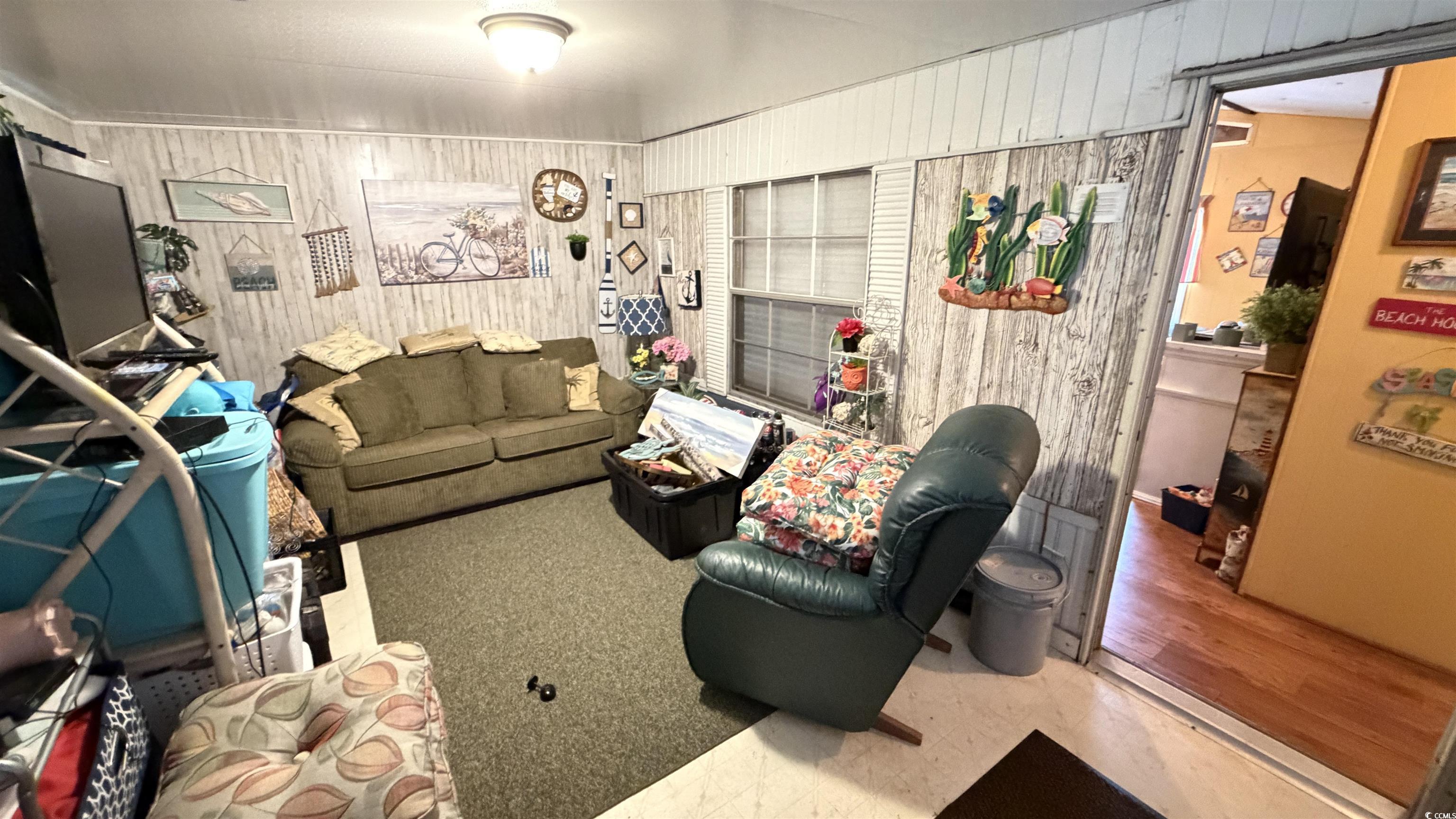 1517 Pisces Lane Myrtle Beach, SC 29575 - Photo 24 of 30 Living area featuring wooden walls