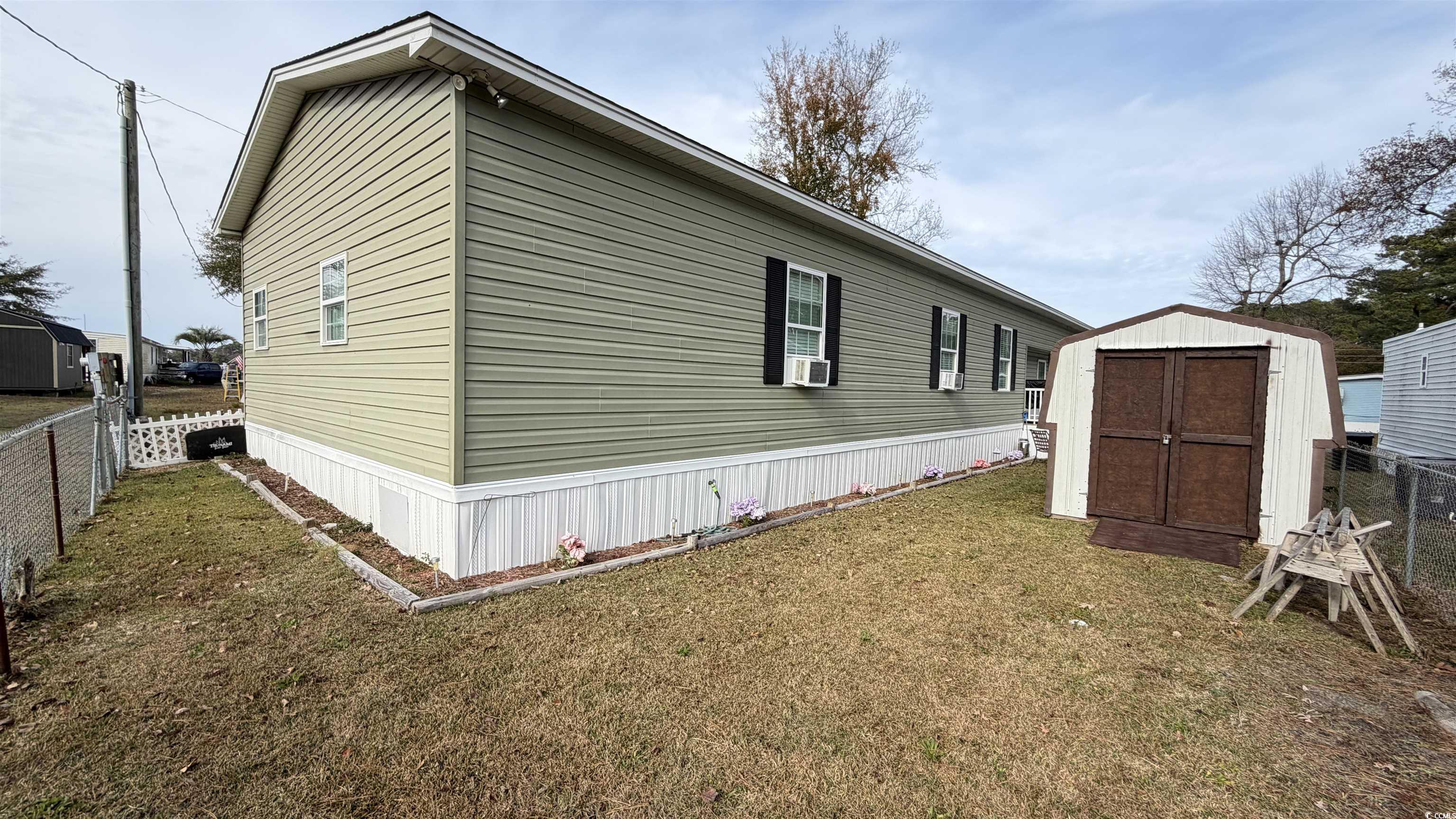 1517 Pisces Lane Myrtle Beach, SC 29575 - Photo 29 of 30 View of property exterior with a shed