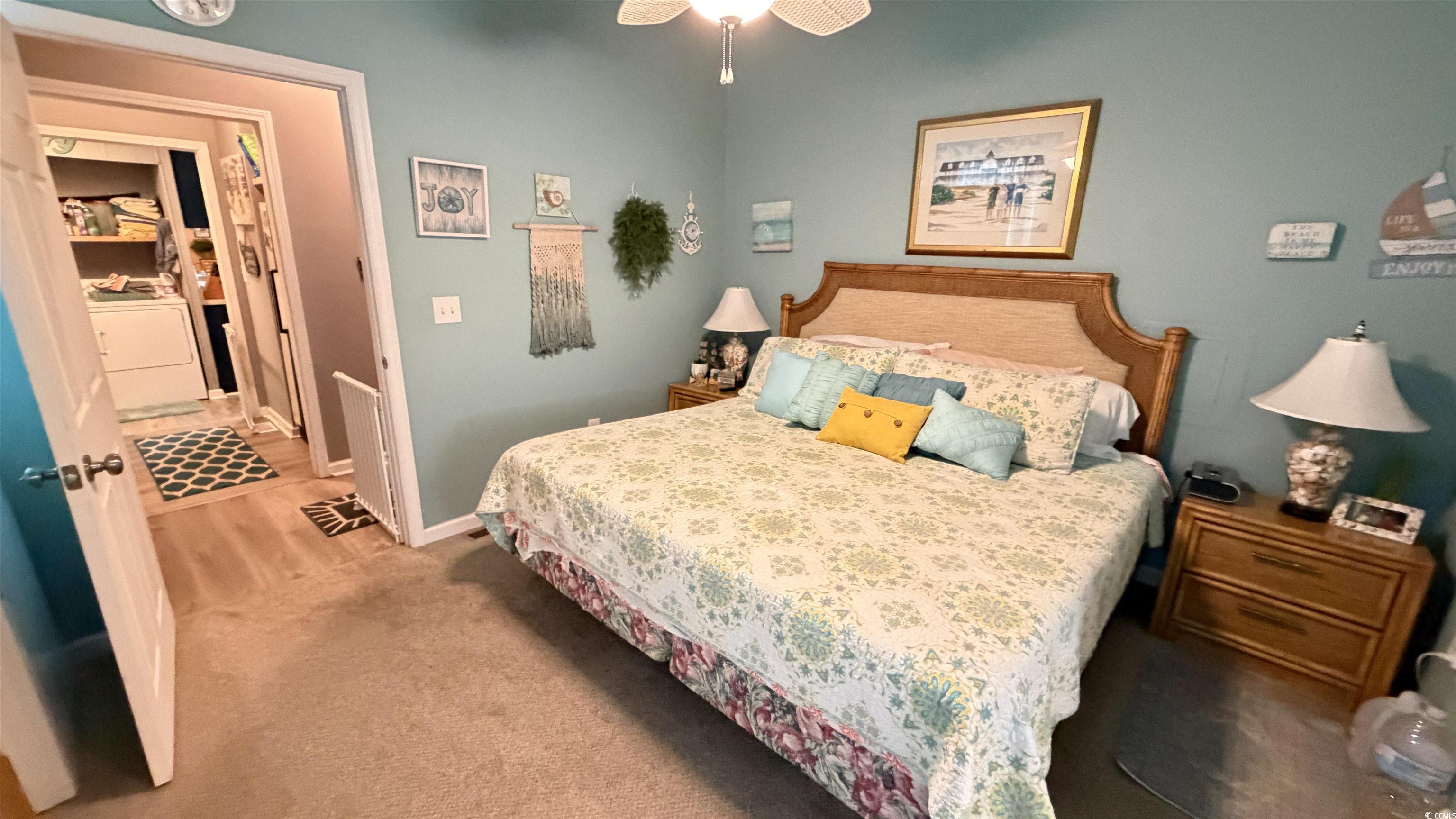 1517 Pisces Lane Myrtle Beach, SC 29575 - Photo 8 of 30 Bedroom featuring washer / dryer, carpet floors, and a ceiling fan