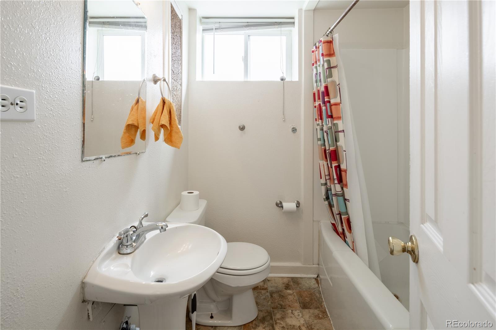 3413 Wadsworth Boulevard Wheat Ridge, CO 80033 - Photo 13 of 25 a bathroom with a sink toilet and shower