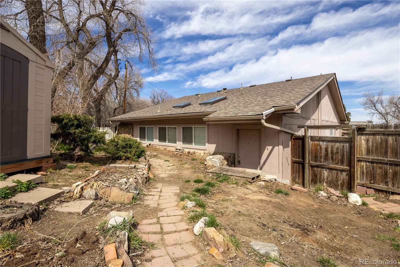 3413 Wadsworth Boulevard Wheat Ridge, CO 80033 - Photo 16 of 25 a view of a house with a yard