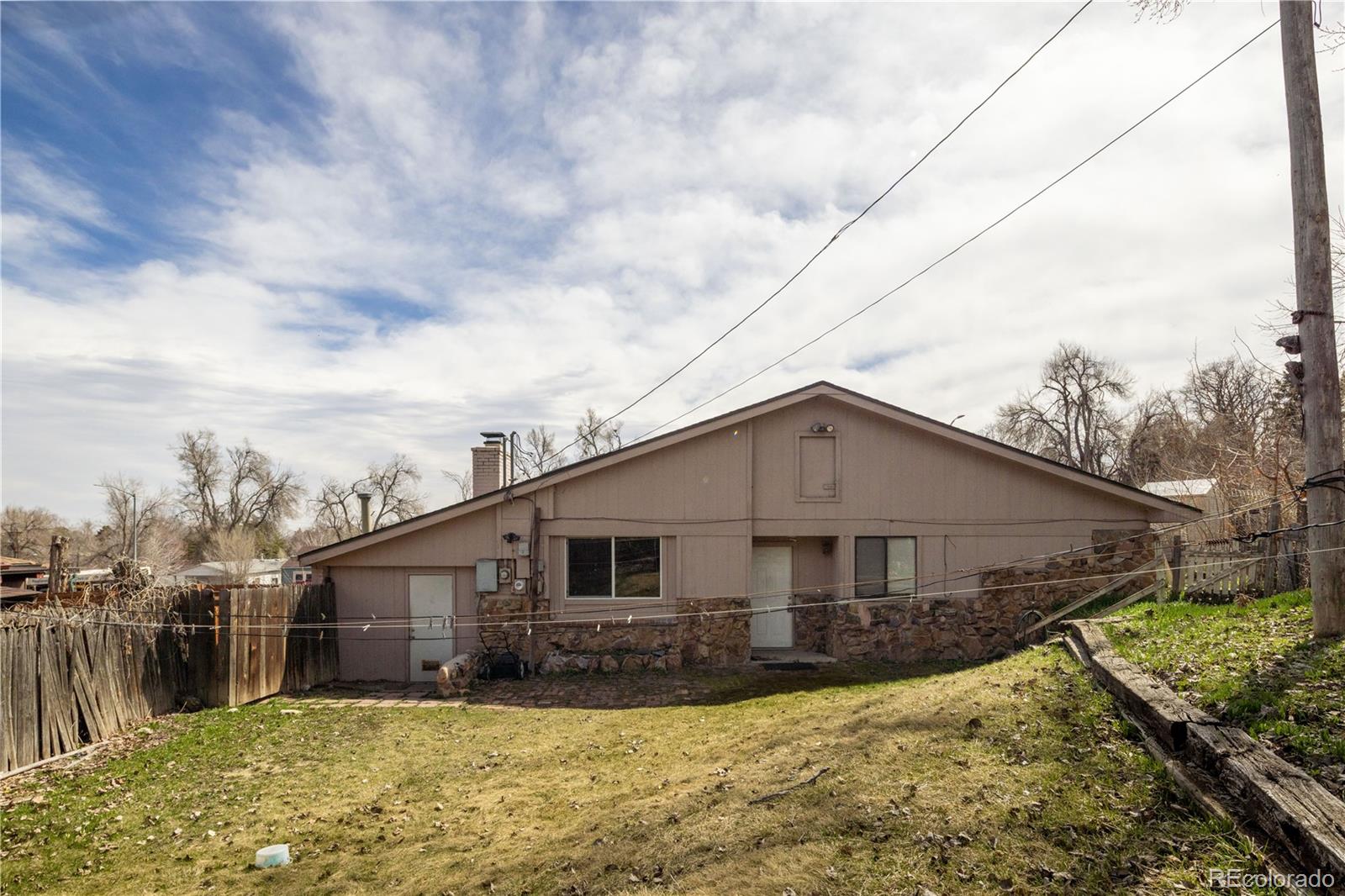 3413 Wadsworth Boulevard Wheat Ridge, CO 80033 - Photo 25 of 25 a view of a house with a yard