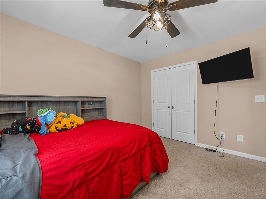 2520 Linmar Circle Anderson, SC 29621 - Photo 32 of 50 Comfortable bedroom featuring soft carpeting and a functional ceiling fan for optimal airflow.