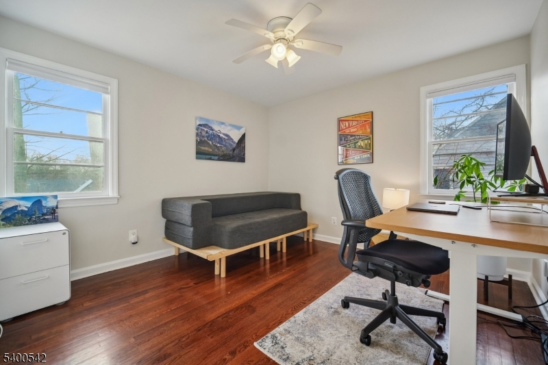 29 Washington Avenue Morristown, NJ 07960 - Photo 18 of 31 a living room with furniture a desk and chair with wooden floor