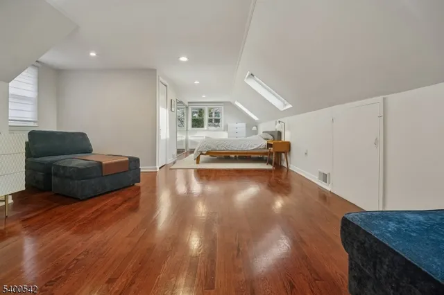 a bed room with a bed and a window