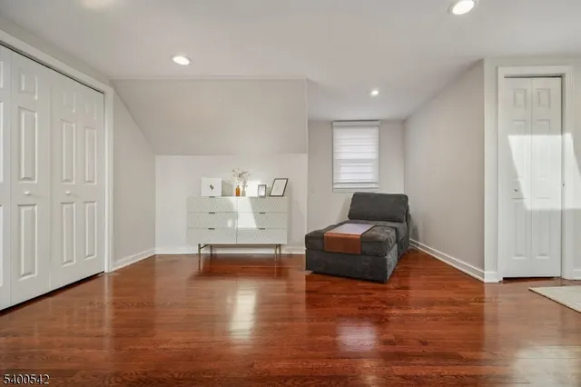 a view of an entryway with wooden floor