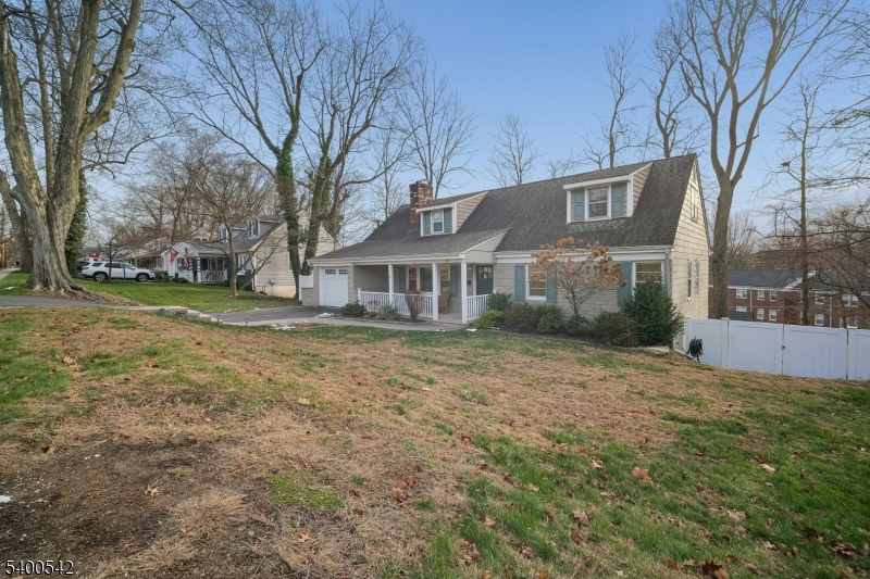 29 Washington Avenue Morristown, NJ 07960 - Photo 3 of 31 a front view of a house with a yard