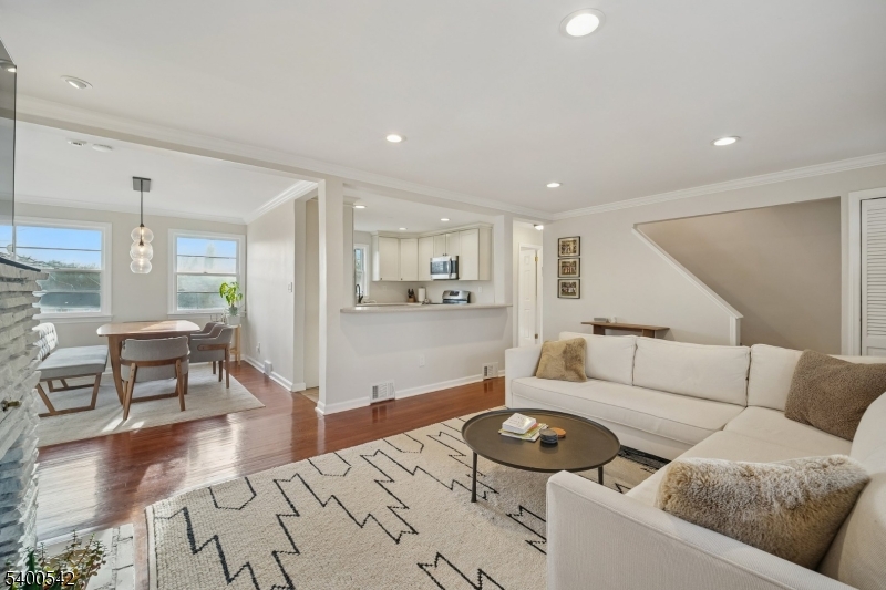 29 Washington Avenue Morristown, NJ 07960 - Photo 7 of 31 a living room with furniture and a wooden floor