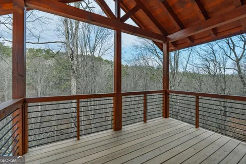 a view of a balcony with wooden floor