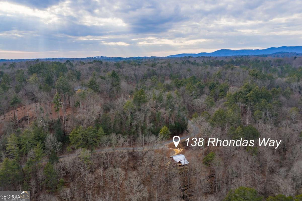 138 Rhondas Way, Unit 106 Ellijay, GA 30540 - Photo 24 of 26 a view of a sign that is sitting on a road