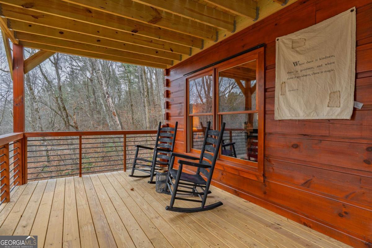 138 Rhondas Way, Unit 106 Ellijay, GA 30540 - Photo 9 of 26 a view of a two chairs in the balcony
