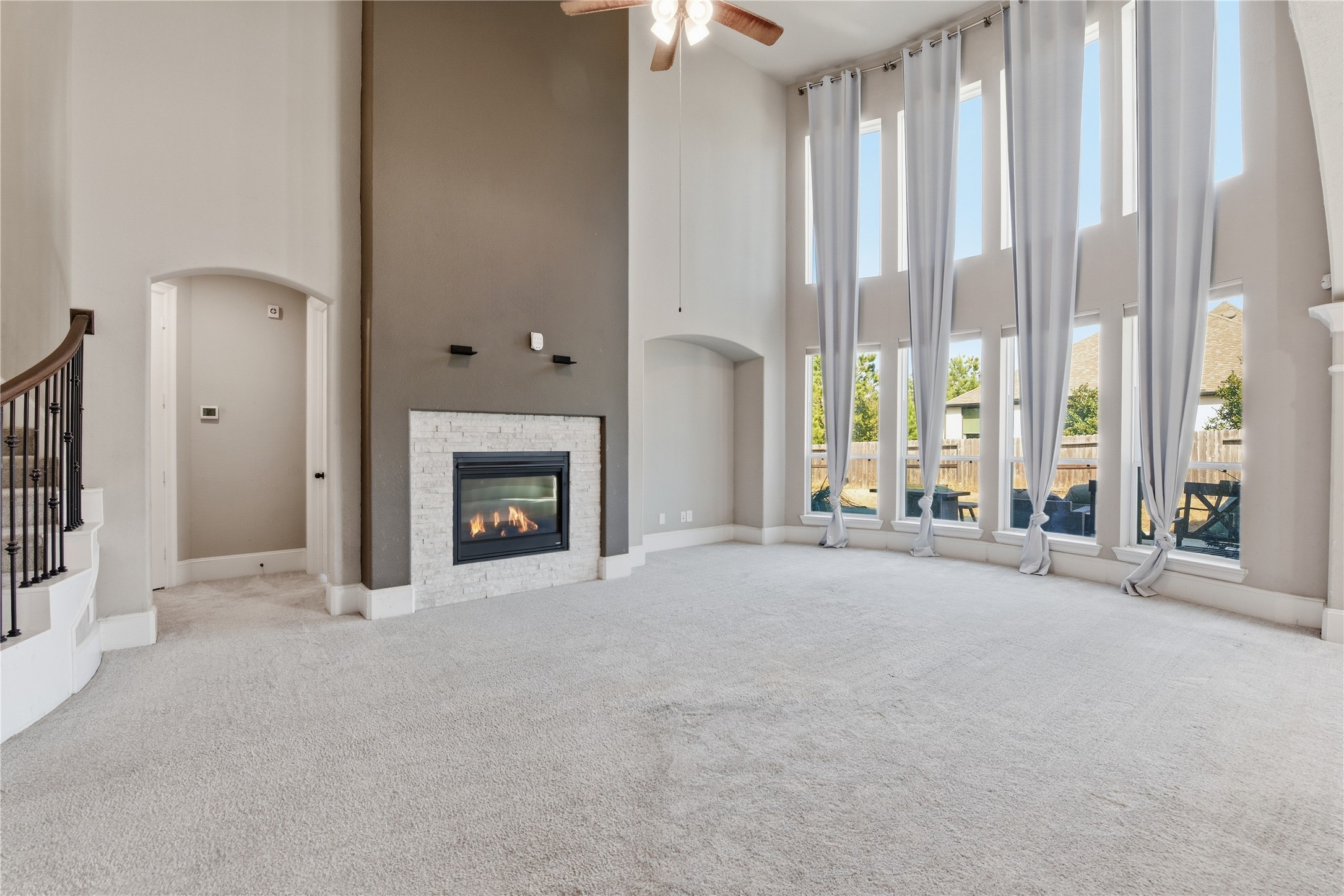 17501 Spice Merlot Lane Conroe, TX 77302 - Photo 14 of 50 a view of an empty room with a fireplace and a window