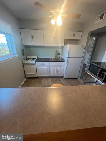 a room with furniture and a flat screen tv