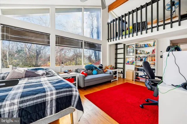 a living room filled with furniture and a flat screen tv