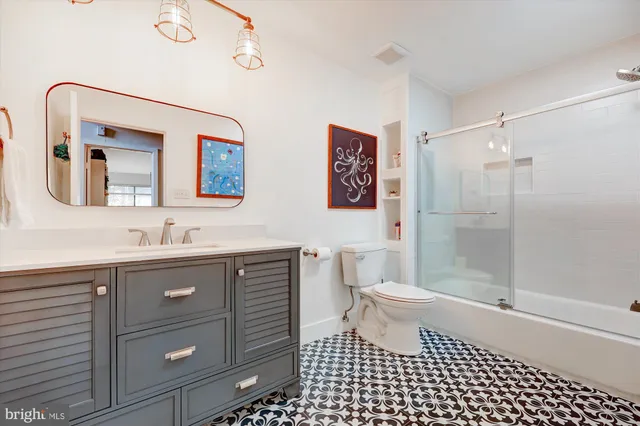 a bedroom with a bed and dresser