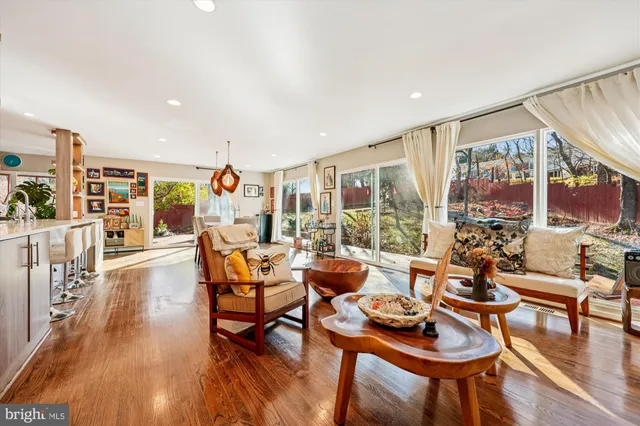 a room with lots of furniture and view of dining room