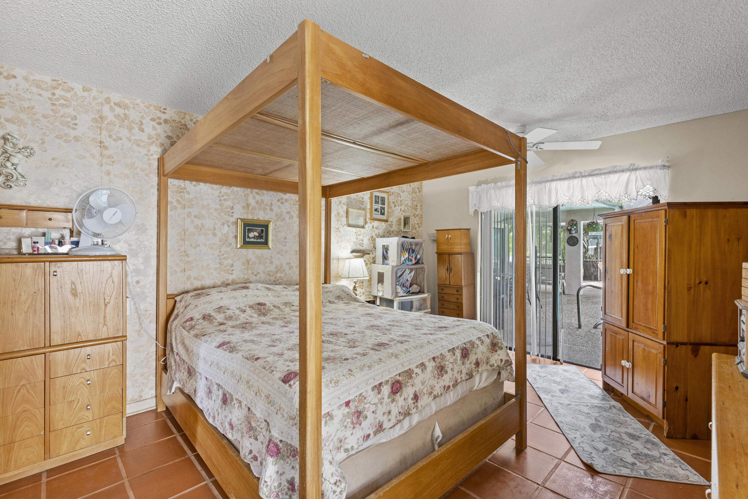 21665 Sutters Lane Boca Raton, FL 33428 - Photo 17 of 42 a bedroom with bed and wooden floor