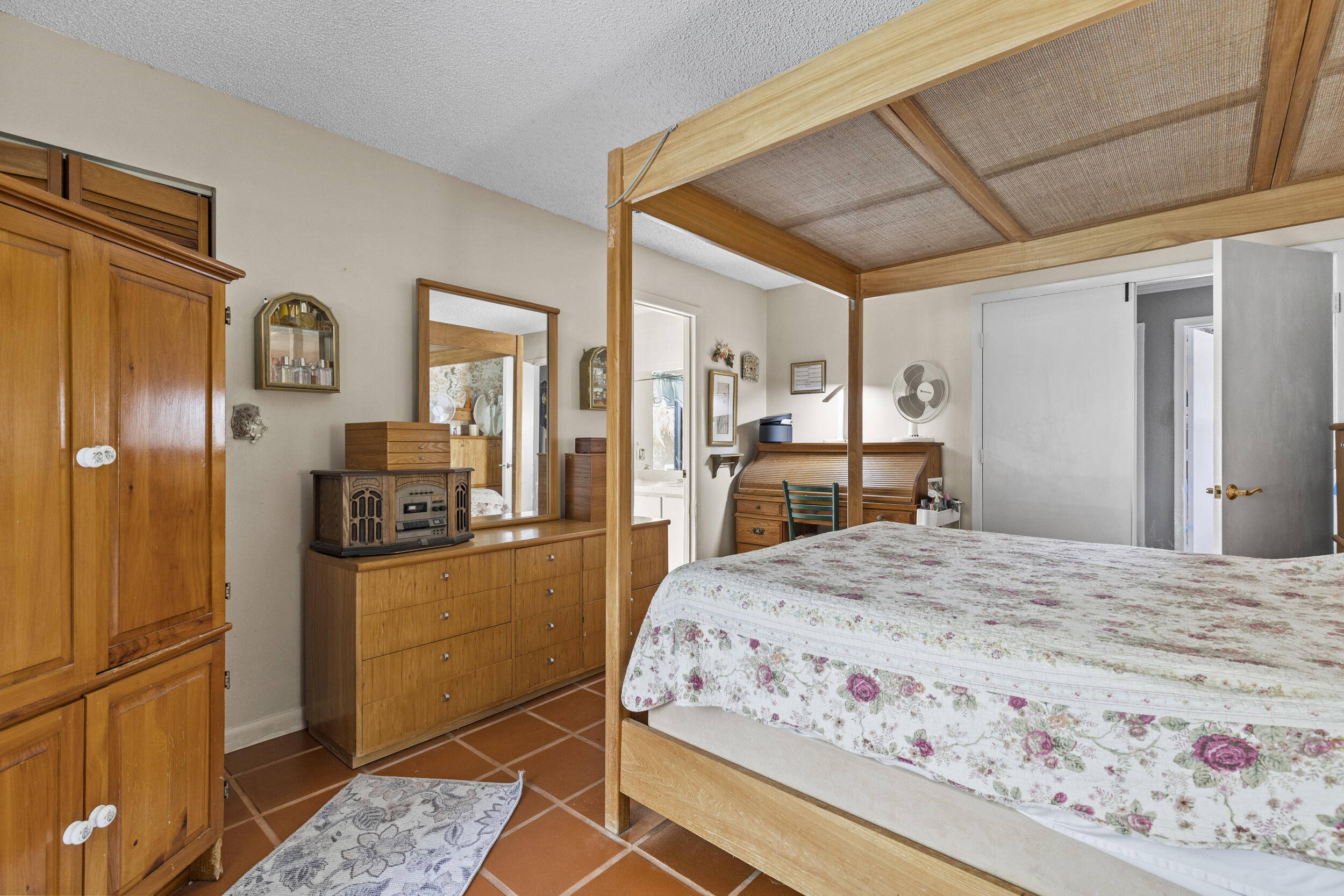 21665 Sutters Lane Boca Raton, FL 33428 - Photo 19 of 42 a bedroom with a bed and a refrigerator