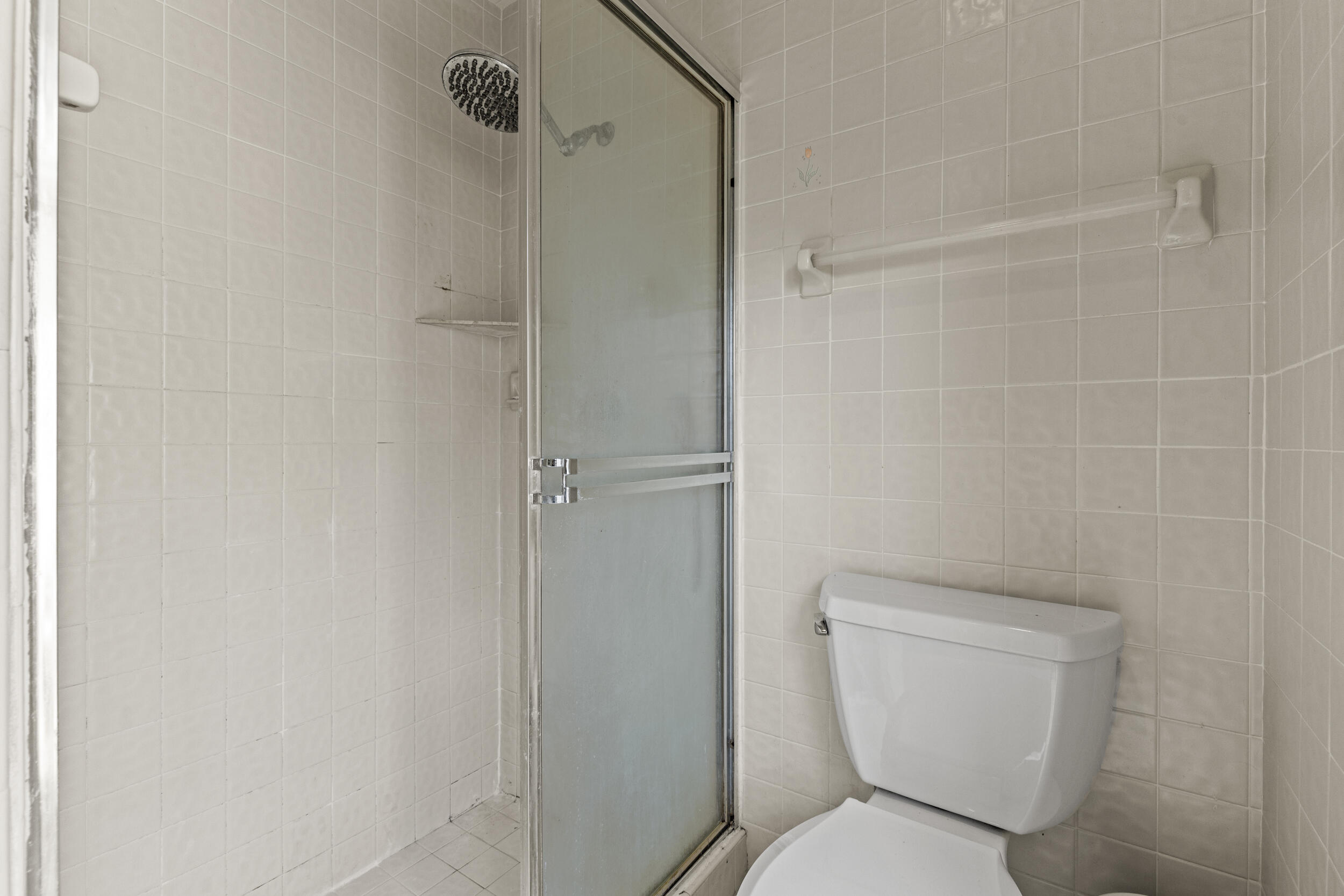21665 Sutters Lane Boca Raton, FL 33428 - Photo 21 of 42 a white toilet sitting next to a shower