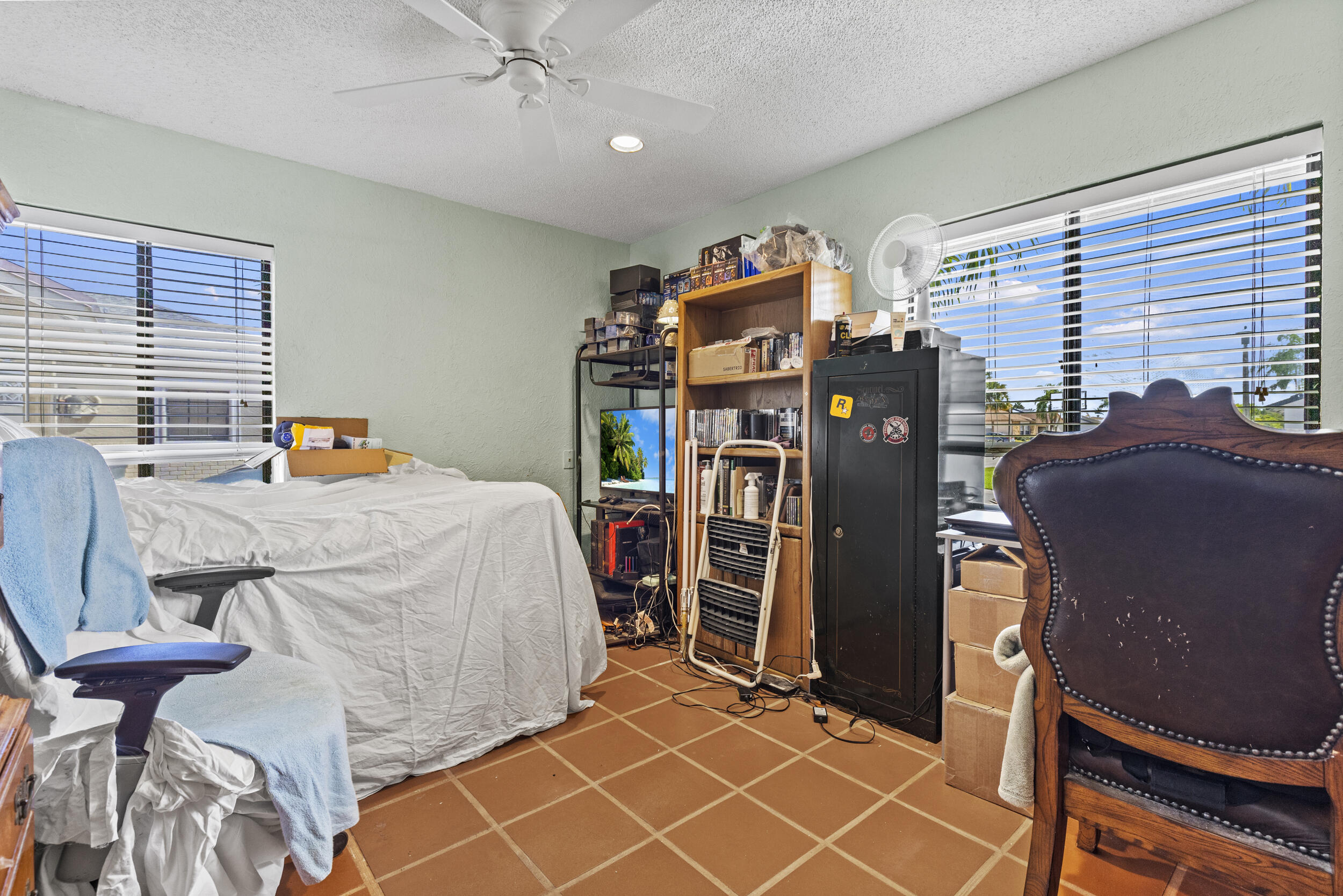 21665 Sutters Lane Boca Raton, FL 33428 - Photo 22 of 42 a bedroom with a bed and a table