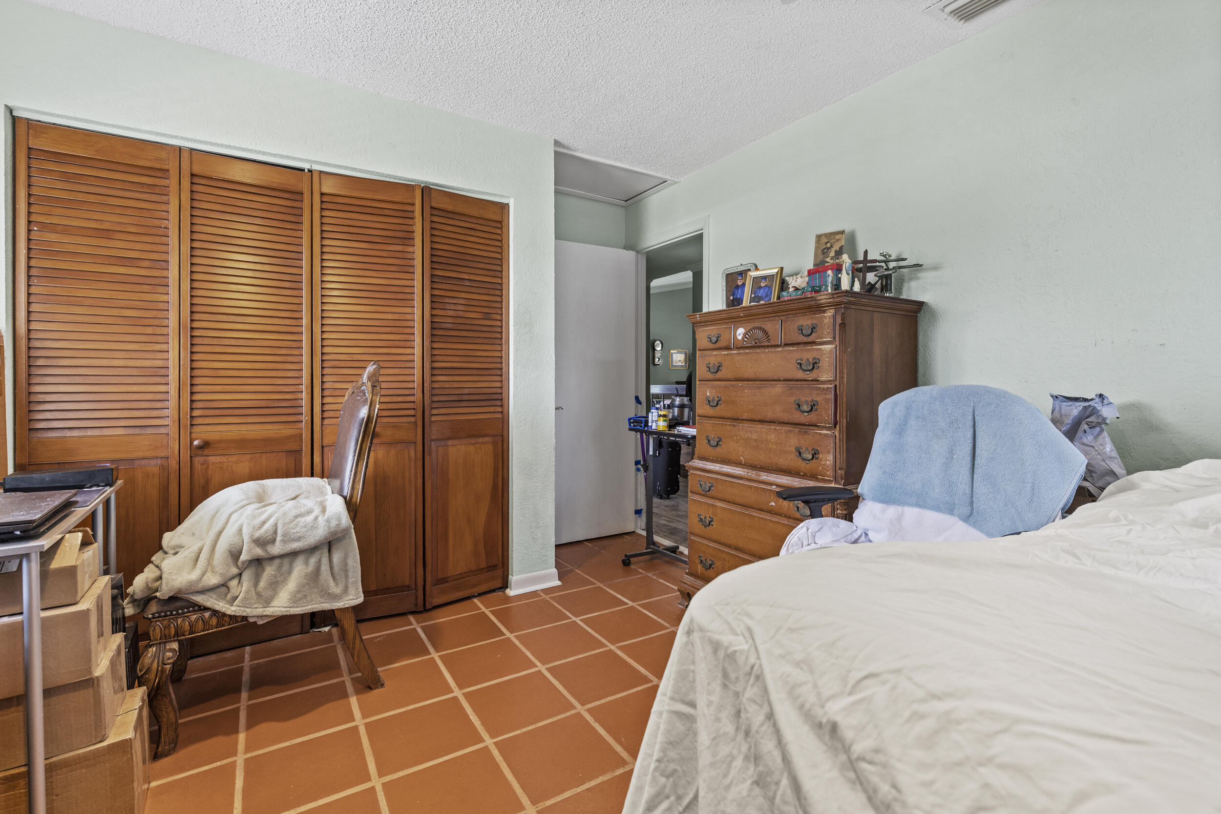 21665 Sutters Lane Boca Raton, FL 33428 - Photo 23 of 42 a bedroom with a bed and a dresser