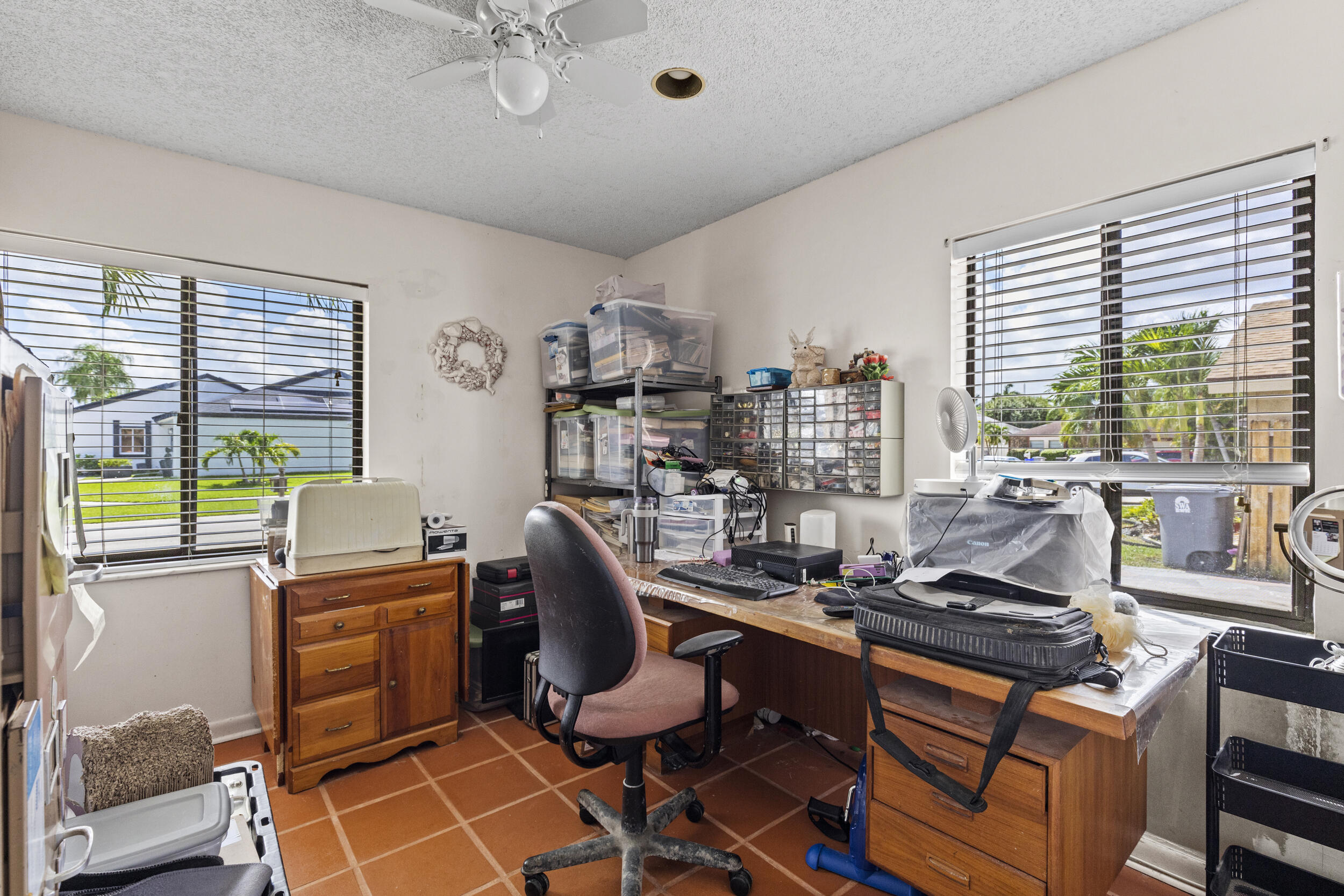 21665 Sutters Lane Boca Raton, FL 33428 - Photo 26 of 42 a room with furniture a large window and a chandelier