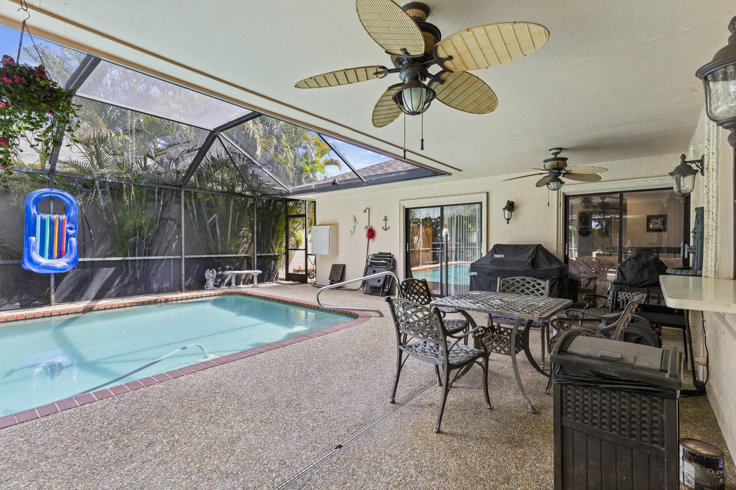 21665 Sutters Lane Boca Raton, FL 33428 - Photo 35 of 42 a view of a livingroom with furniture and a table