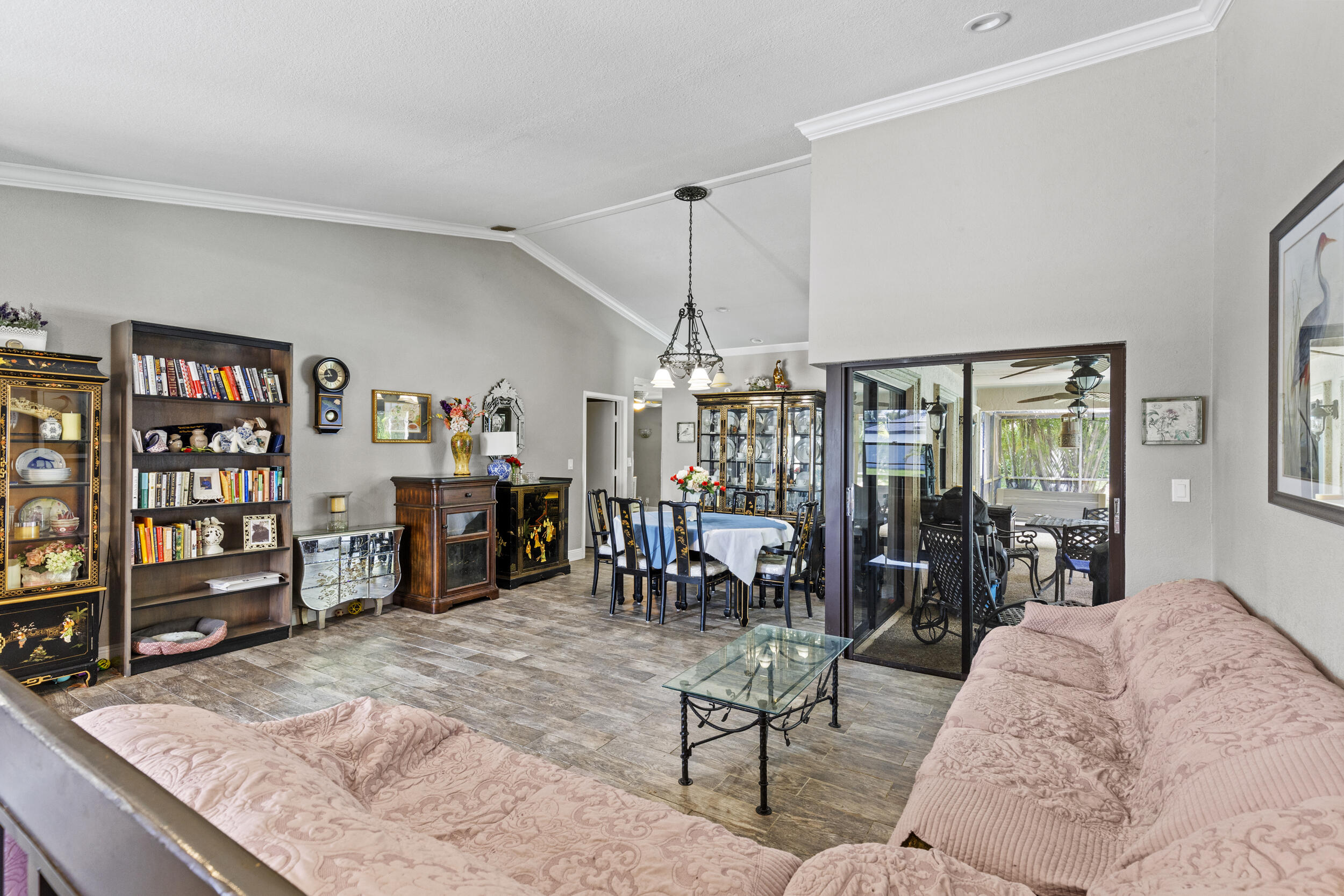 21665 Sutters Lane Boca Raton, FL 33428 - Photo 6 of 42 a living room with lots of furniture and book shelf