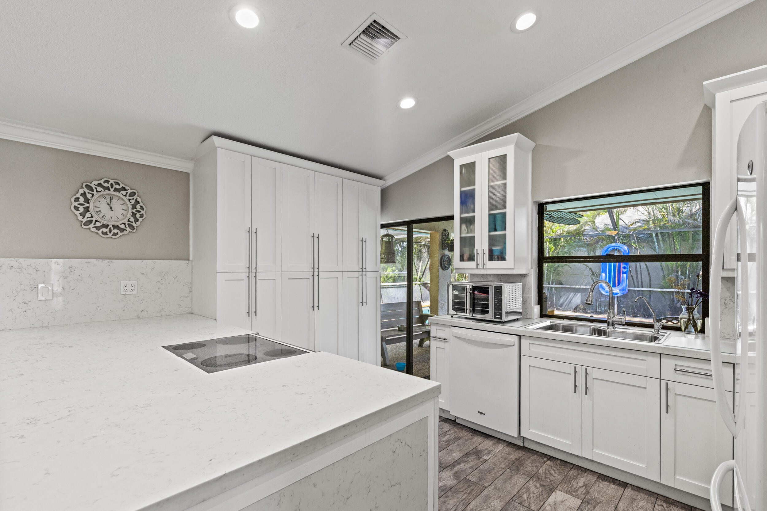 21665 Sutters Lane Boca Raton, FL 33428 - Photo 10 of 42 a kitchen with stainless steel appliances a sink a stove and a refrigerator