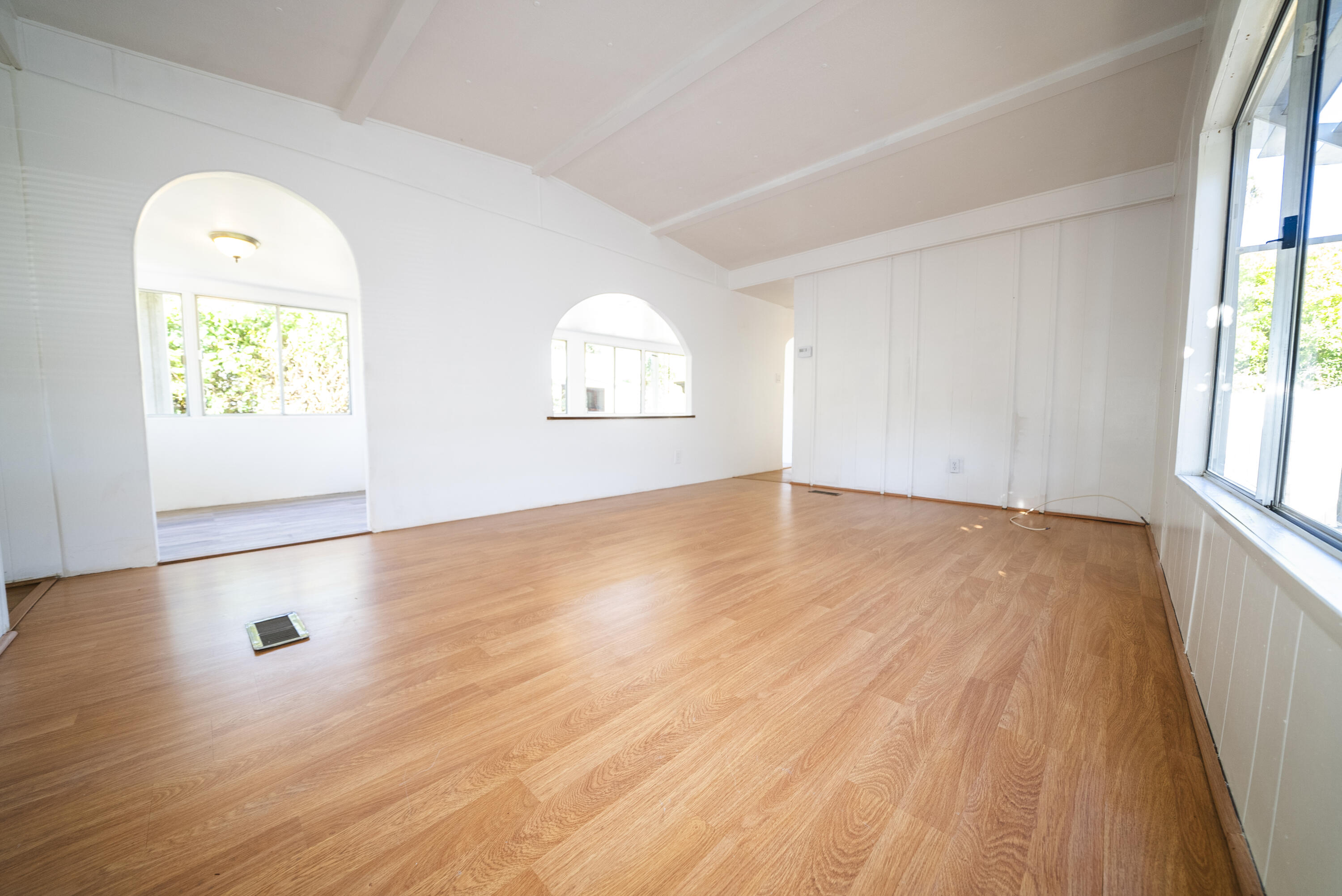 4025 State Street, Unit 26 Santa Barbara, CA 93110 - Photo 11 of 20 an empty room with wooden floor and windows